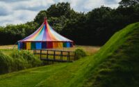 blue green and yellow hammock on green grass field